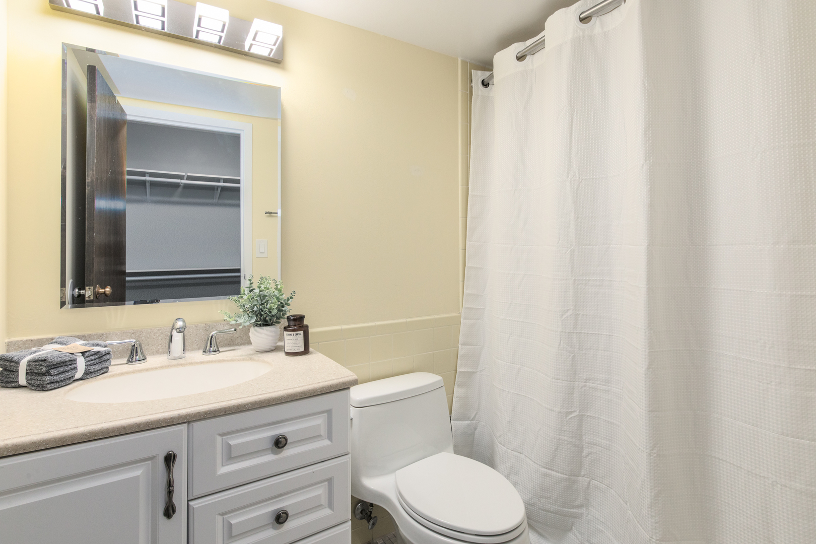1110 Grove Street, Unit 4H Downers Grove, IL 60515 - Photo 20 of 30 a bathroom with a granite countertop sink toilet and mirror