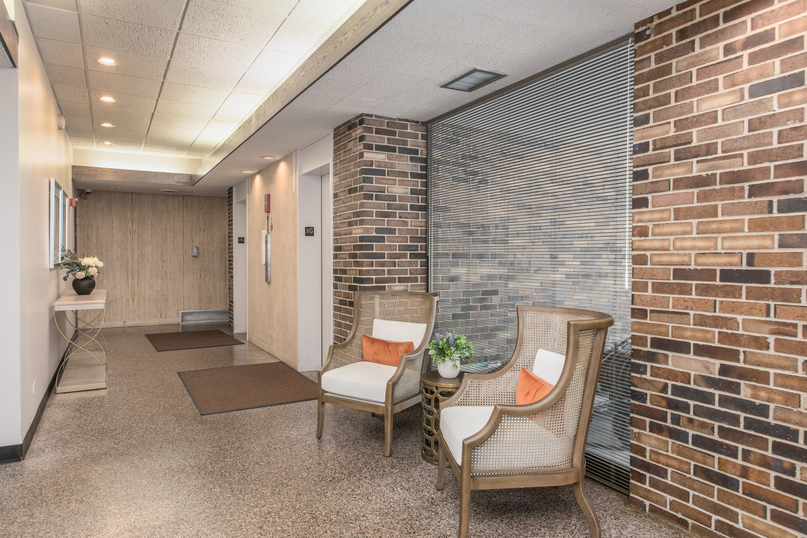 1110 Grove Street, Unit 4H Downers Grove, IL 60515 - Photo 25 of 30 a view of a patio with a table and chairs and potted plants