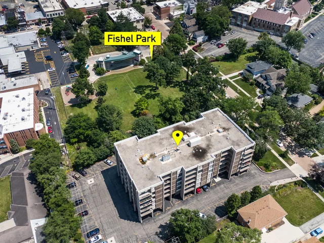 an aerial view of a house with swimming pool and outdoor space