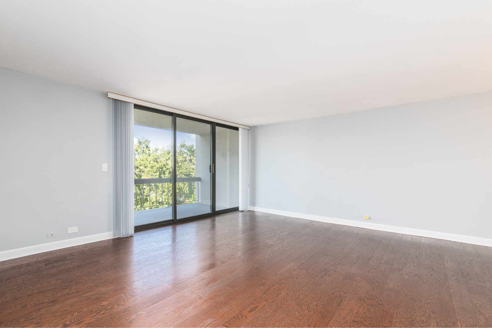 1110 Grove Street, Unit 4H Downers Grove, IL 60515 - Photo 5 of 30 a view of an empty room with wooden floor and a window