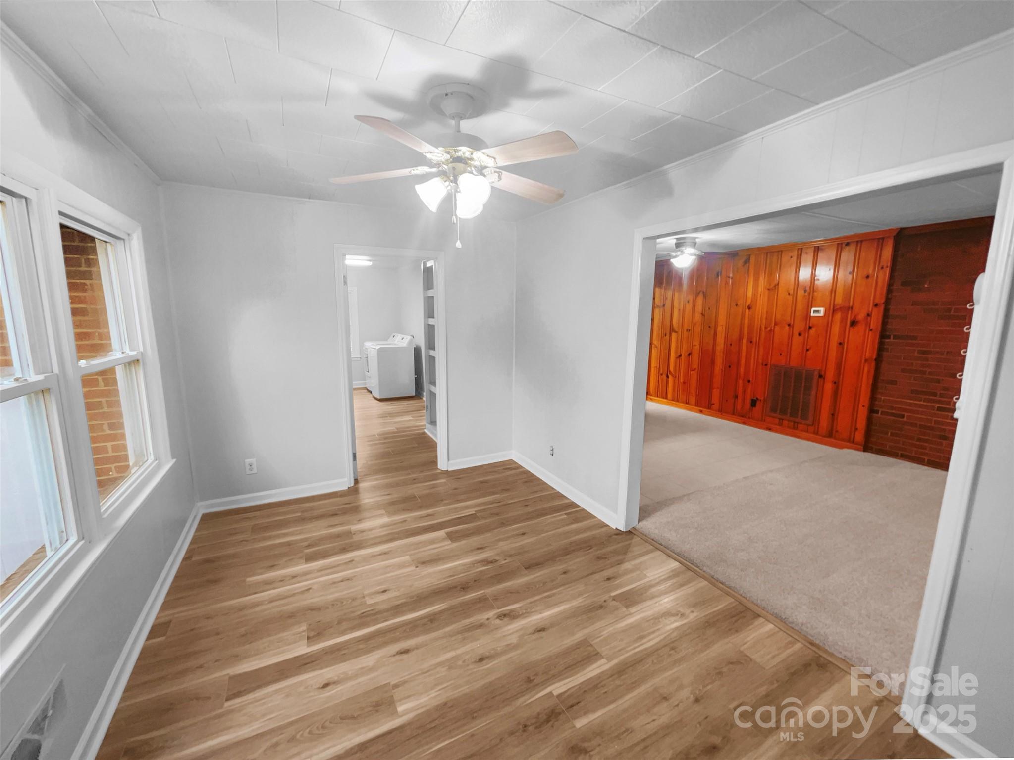 2009 Hickory Grove Road Gastonia, NC 28056 - Photo 14 of 20 a view of an empty room with wooden floor and a window