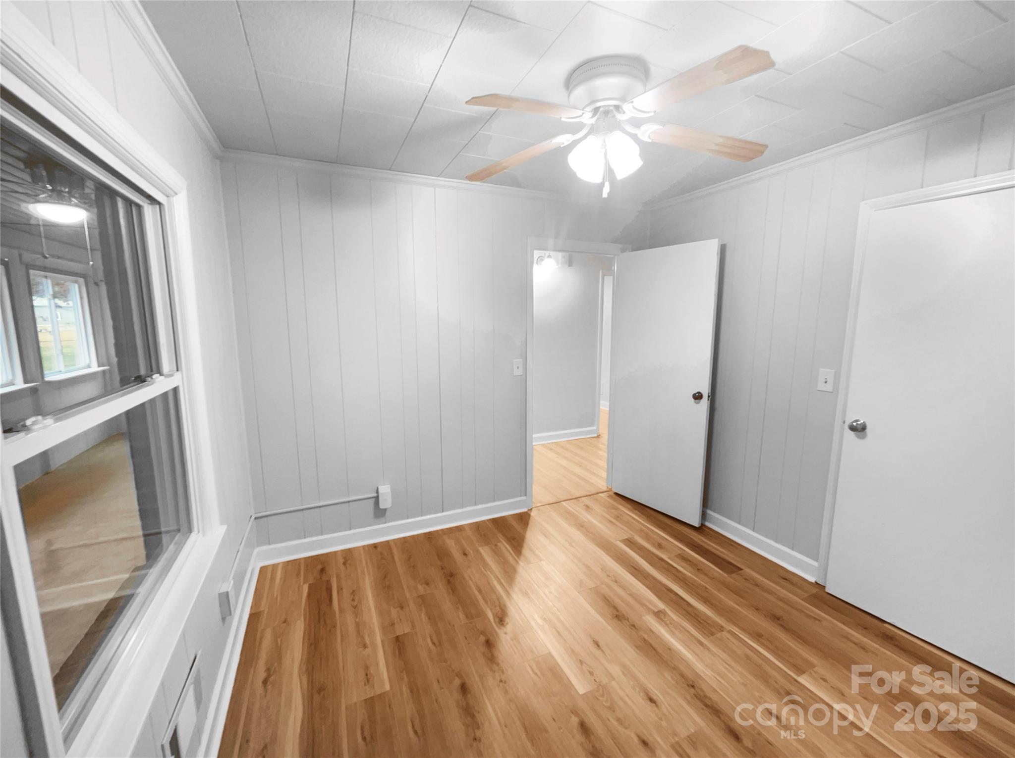 2009 Hickory Grove Road Gastonia, NC 28056 - Photo 15 of 20 a view of an empty room with window and wooden floor