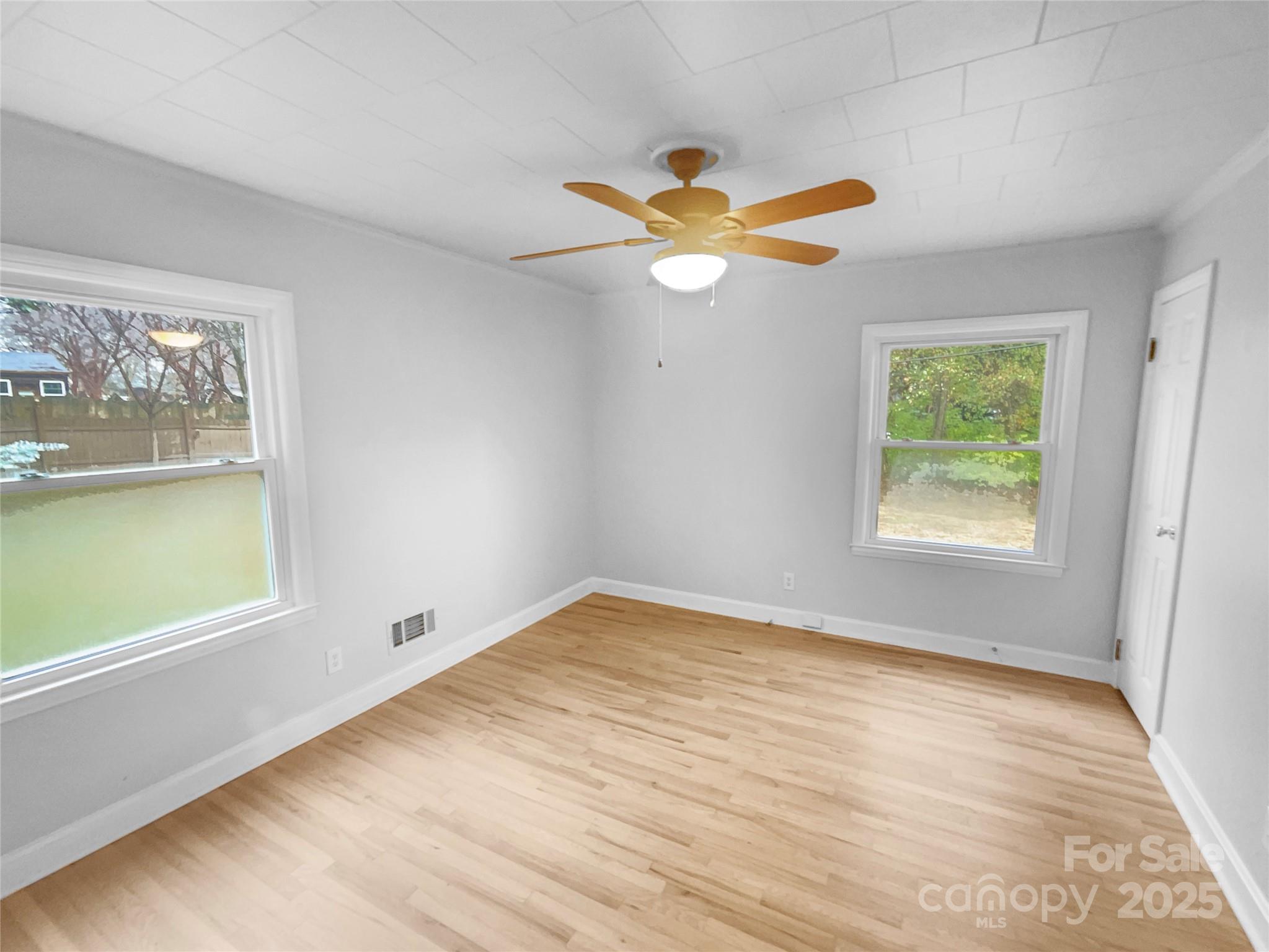 2009 Hickory Grove Road Gastonia, NC 28056 - Photo 16 of 20 a view of empty room with window and ceiling fan