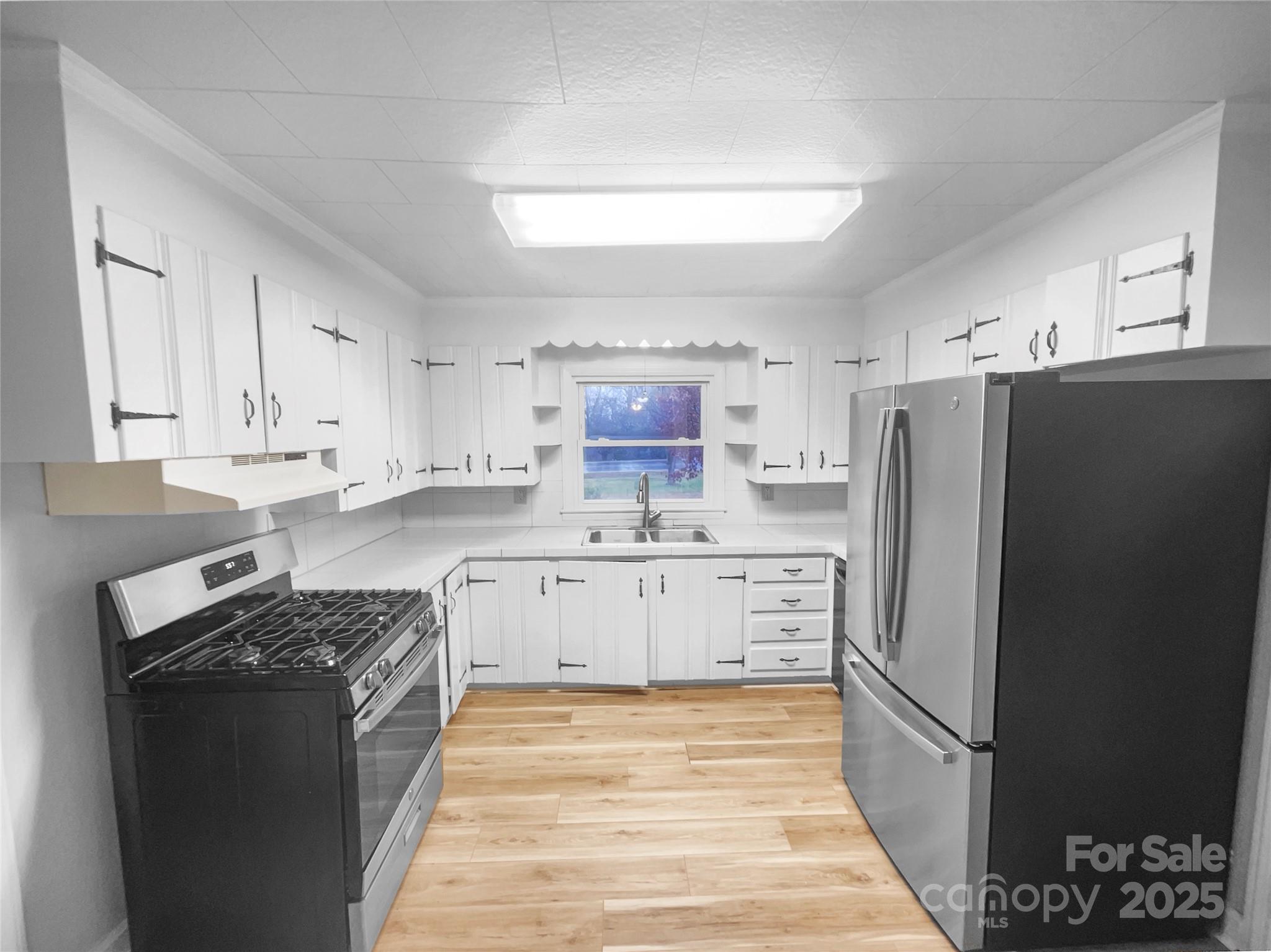 2009 Hickory Grove Road Gastonia, NC 28056 - Photo 2 of 20 a kitchen with stainless steel appliances a refrigerator stove and sink