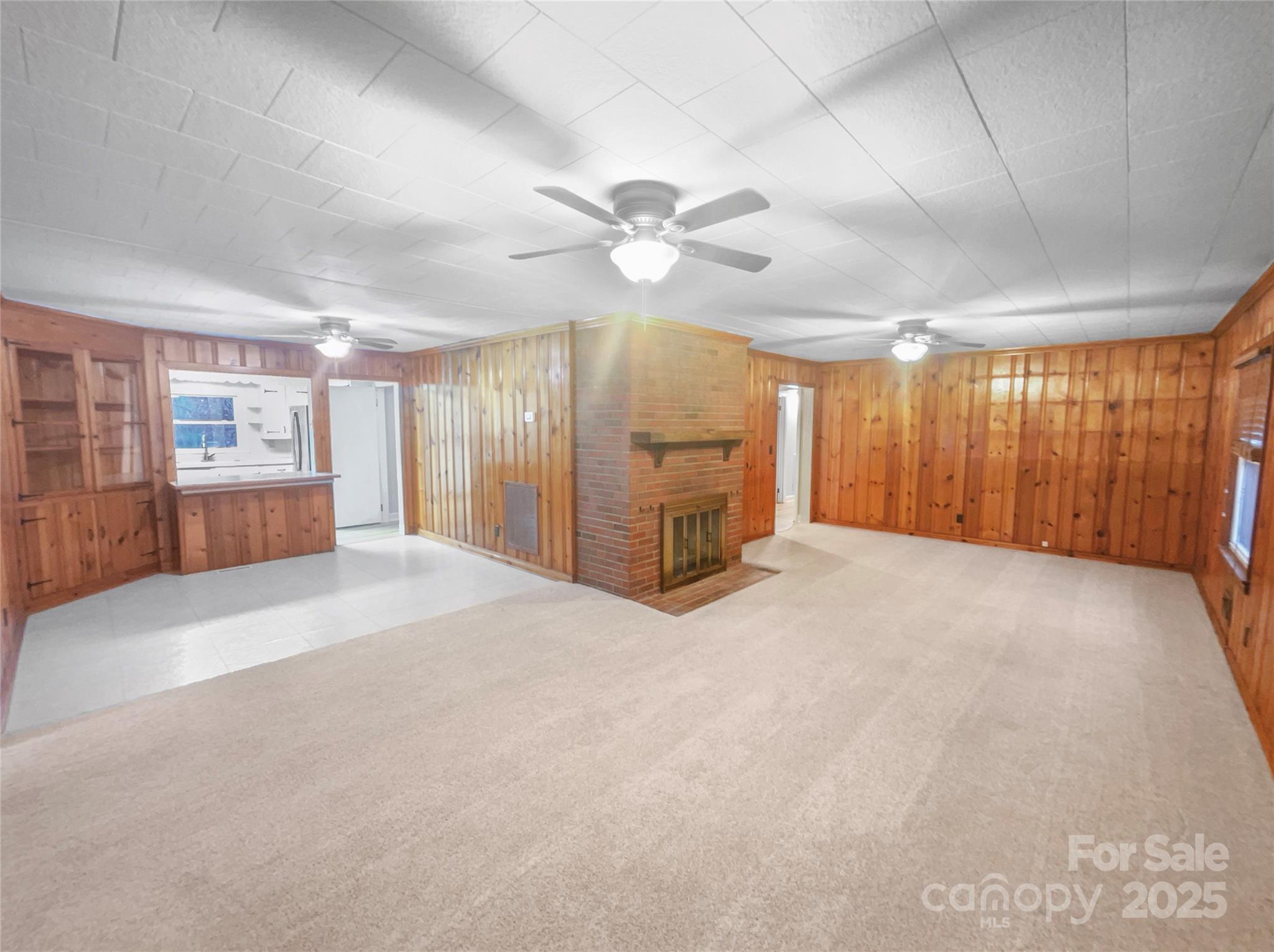 2009 Hickory Grove Road Gastonia, NC 28056 - Photo 9 of 20 a view of a livingroom with a chandelier fan and windows