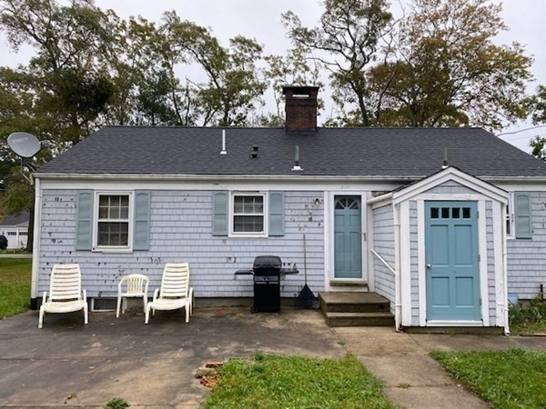 404 Great Marsh Road Centerville, MA 02632 - Photo 1 of 1 a front view of a house with a garden