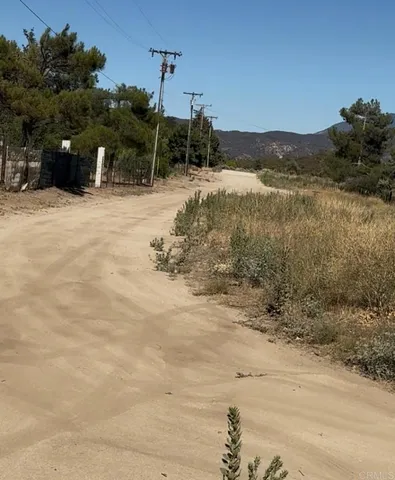 a view of a road with a building in the background
