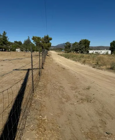 a view of a pathway with a ocean view