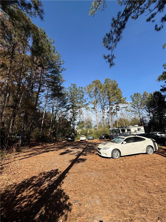 6387 Bells Ferry Road Acworth, GA 30102 - Photo 17 of 28 a view of a swimming pool with some trees