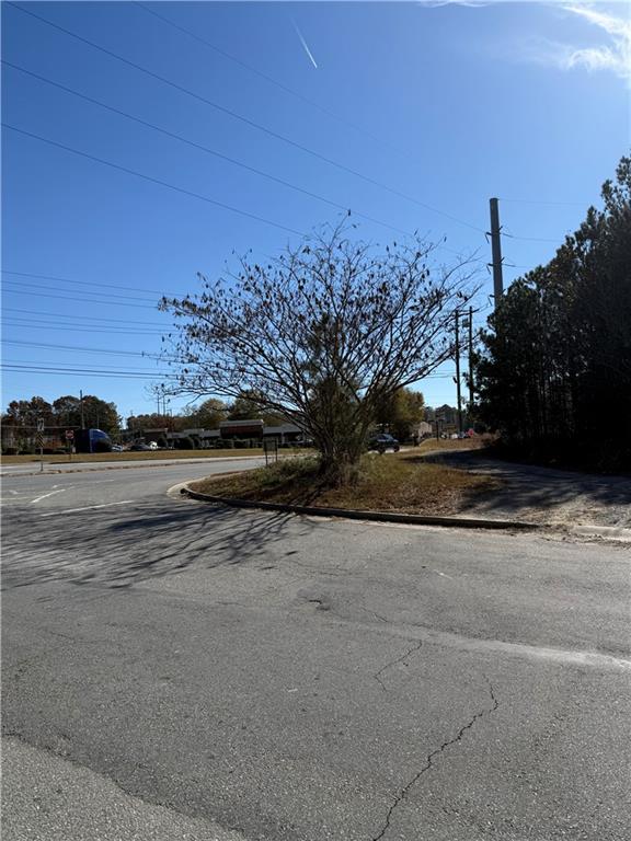 6387 Bells Ferry Road Acworth, GA 30102 - Photo 22 of 28 a view of dirt road with a building in the background