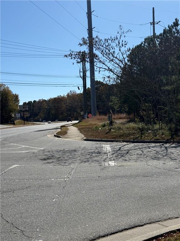 6387 Bells Ferry Road Acworth, GA 30102 - Photo 27 of 28 a backyard of a house with lots of green space