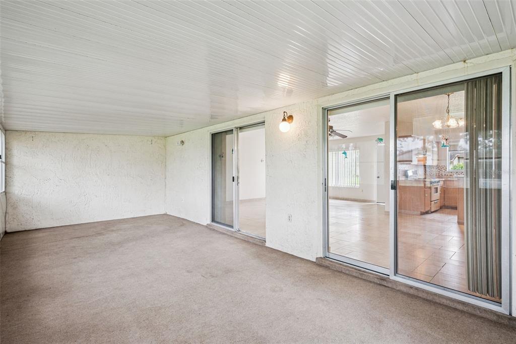 10113 Musket Lane Orlando, FL 32821 - Photo 21 of 23 a view of an empty room with glass door
