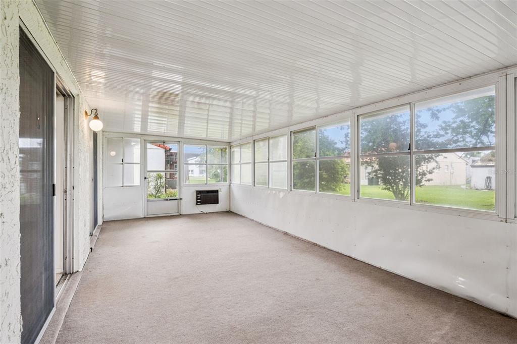 10113 Musket Lane Orlando, FL 32821 - Photo 22 of 23 a view of an empty room with a sliding door