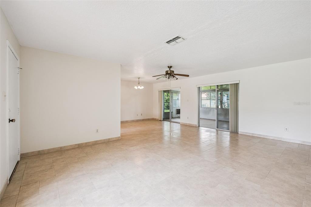 10113 Musket Lane Orlando, FL 32821 - Photo 7 of 23 a view of an empty room with a window