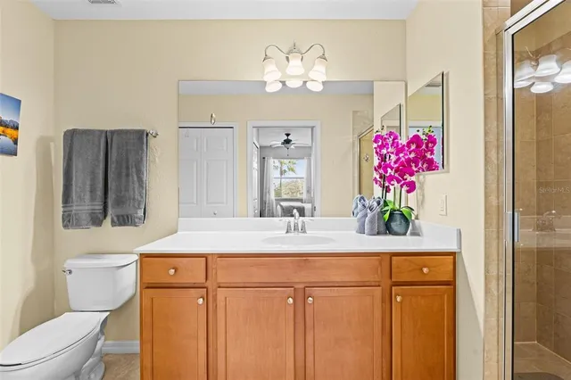 a bedroom with two beds and painting on the wall