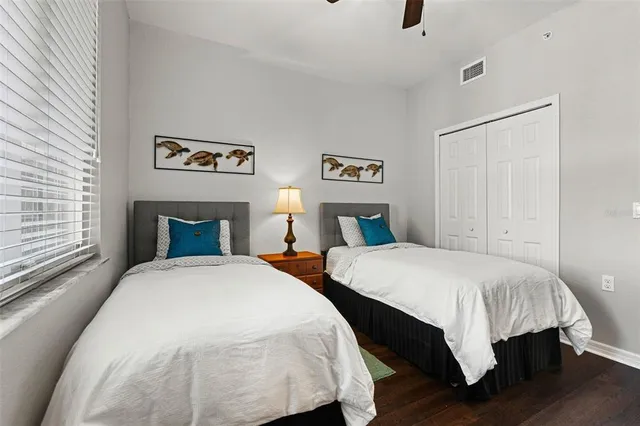 a bathroom with a sink a toilet a mirror and shower