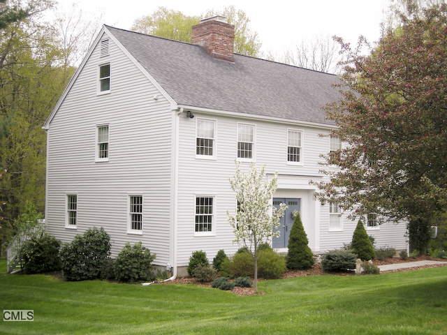 6 Concord Ridge Road Newtown, CT 06470 - Photo 1 of 1 a front view of a house with a garden