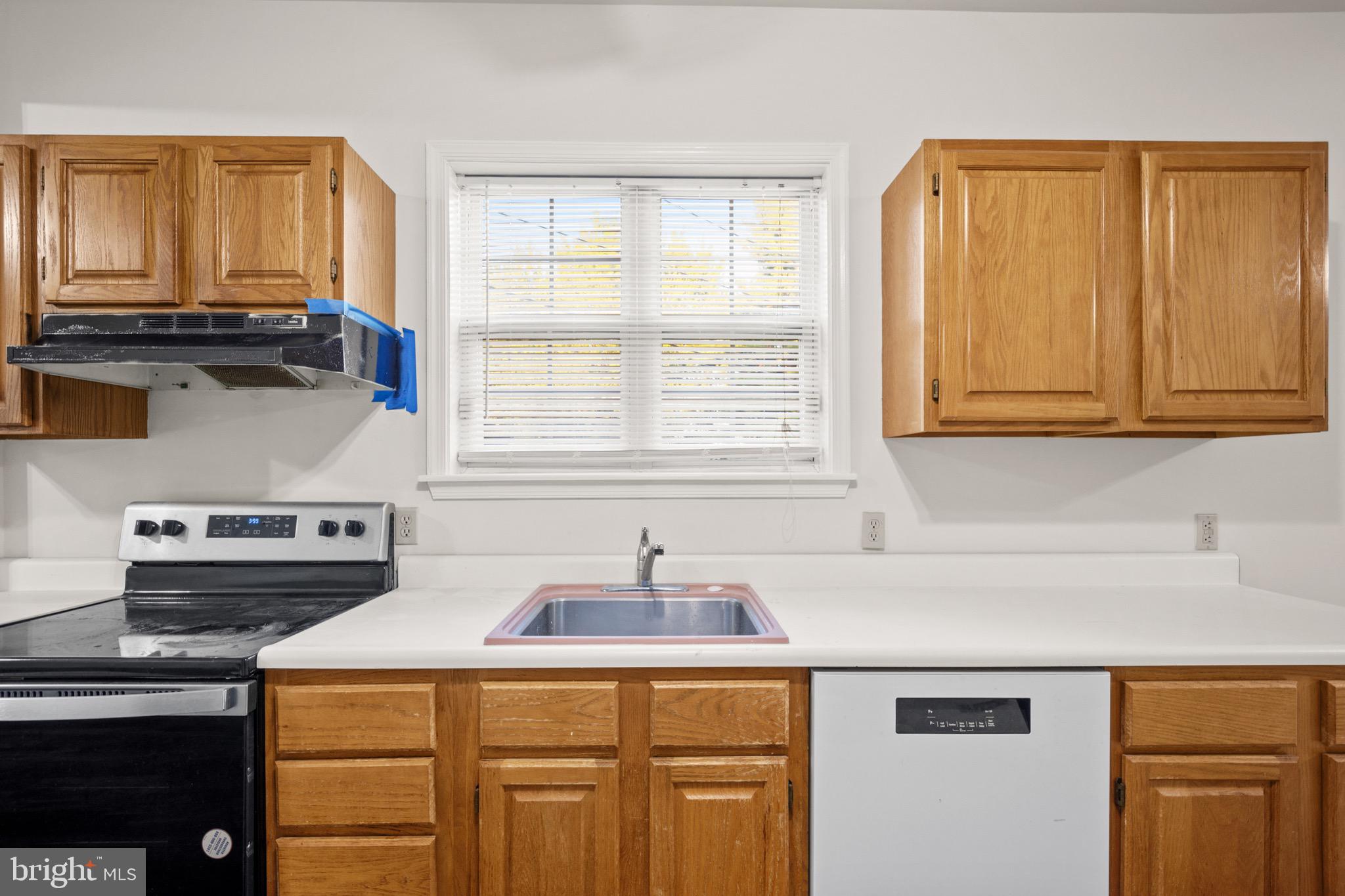 4040 Concord Road Aston, PA 19014 - Photo 7 of 22 a kitchen with stainless steel appliances a sink a stove and a microwave