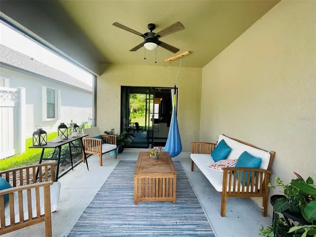 a living room with furniture wooden floor and a table