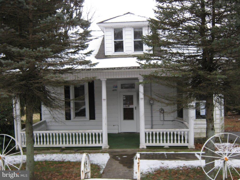 front view of a house with a deck