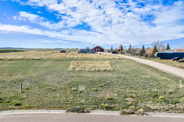 a view of swimming pool with a yard and mountain in the back
