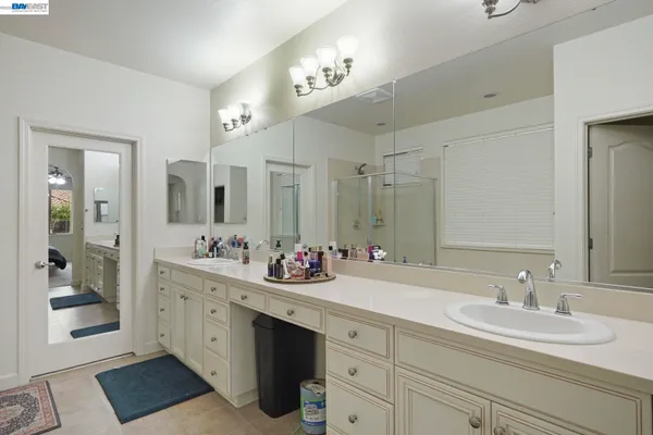 a bathroom with a double vanity sink mirror and double