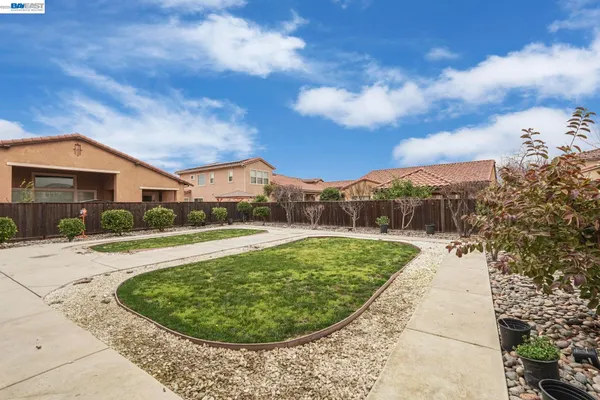 a view of a swimming pool with a yard