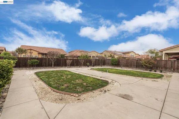 a view of a swimming pool with a yard