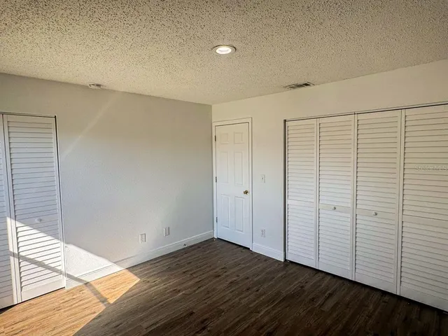a view of a livingroom with wooden floor