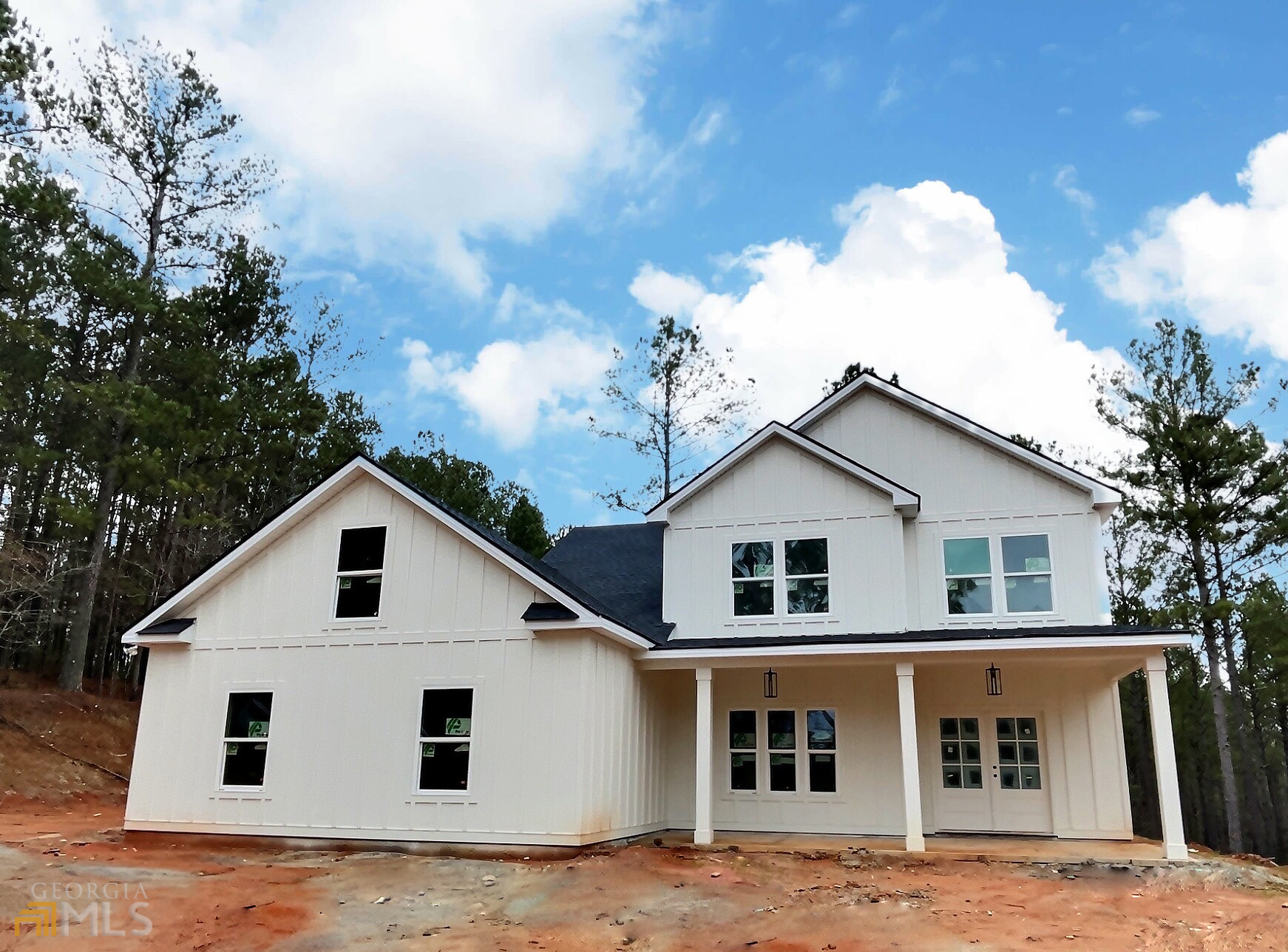 311 Hogan-Coweta Road Grantville, GA 30220 - Photo 1 of 1 a view of a white house with a yard