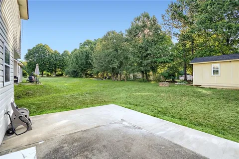 a view of a backyard with a sitting area