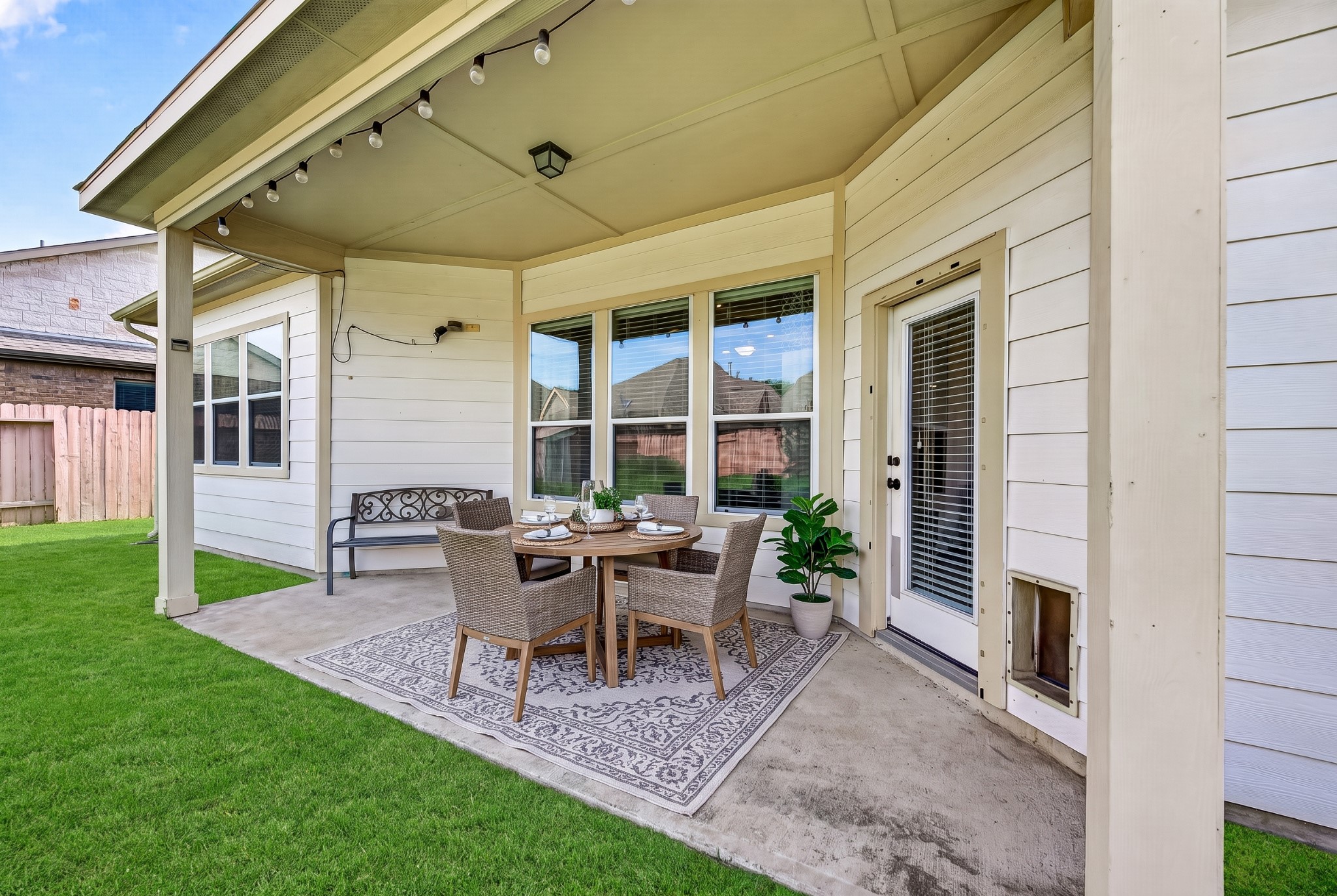 4314 Kent Ranch Court Katy, TX 77494 - Photo 45 of 49 Covered back patio - virtually staged. Ceiling light and large windows overlooking the yard.