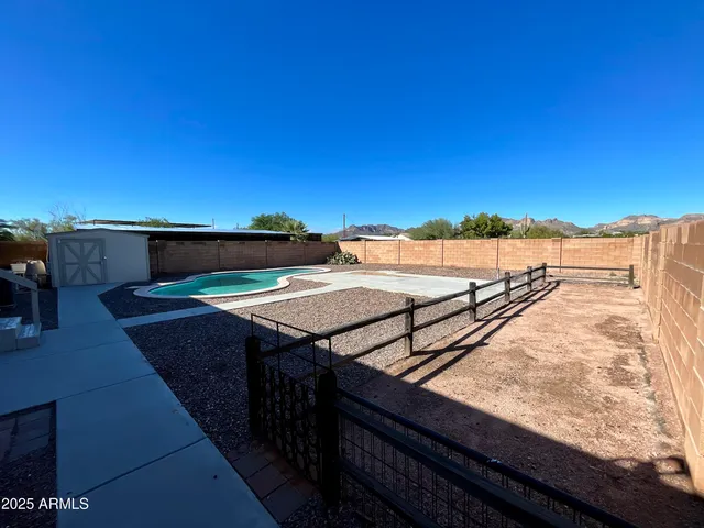 a view of a backyard of the house