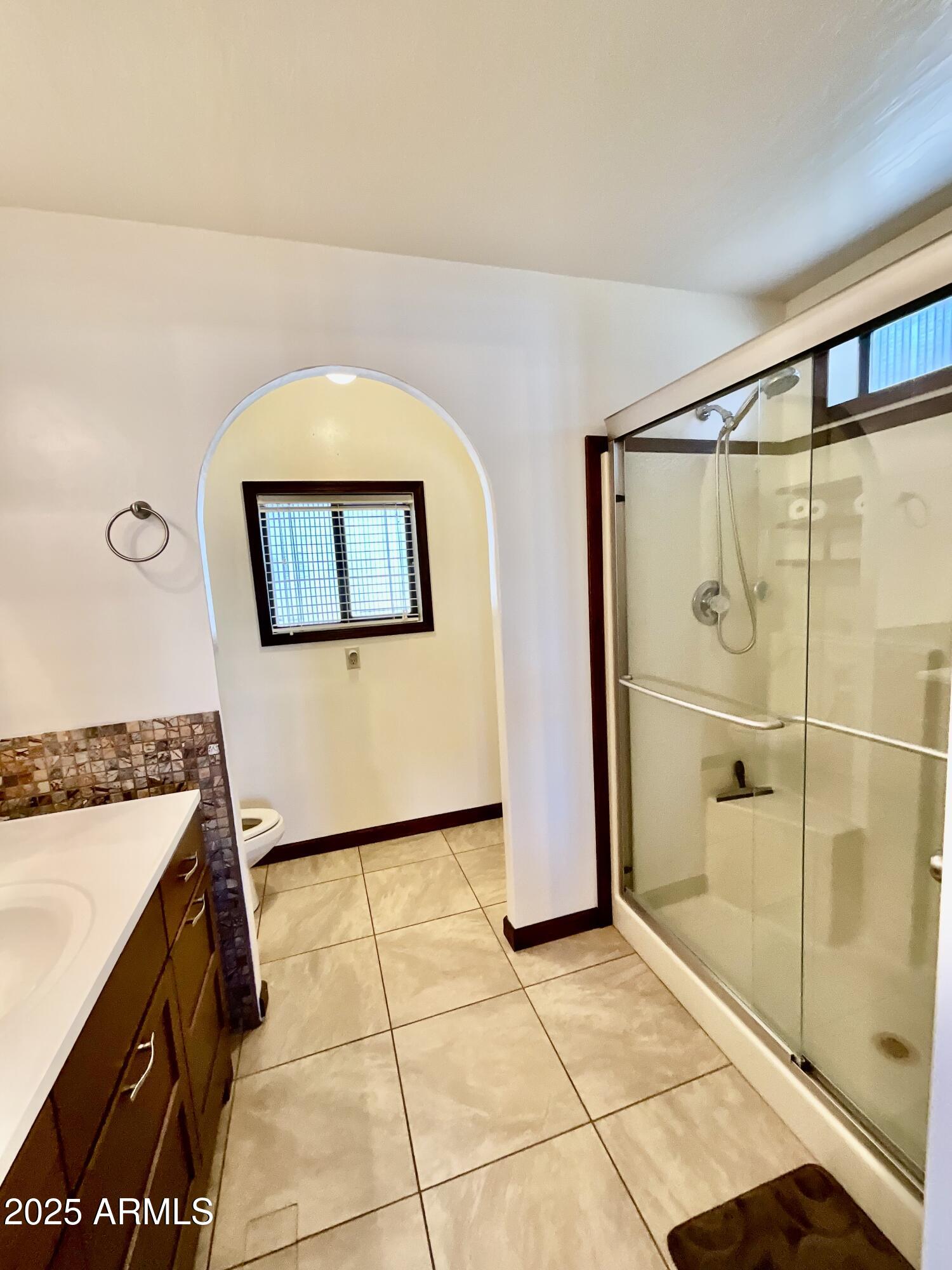 322 West Foothill Street Apache Junction, AZ 85120 - Photo 19 of 33 a bathroom with a sink and a mirror