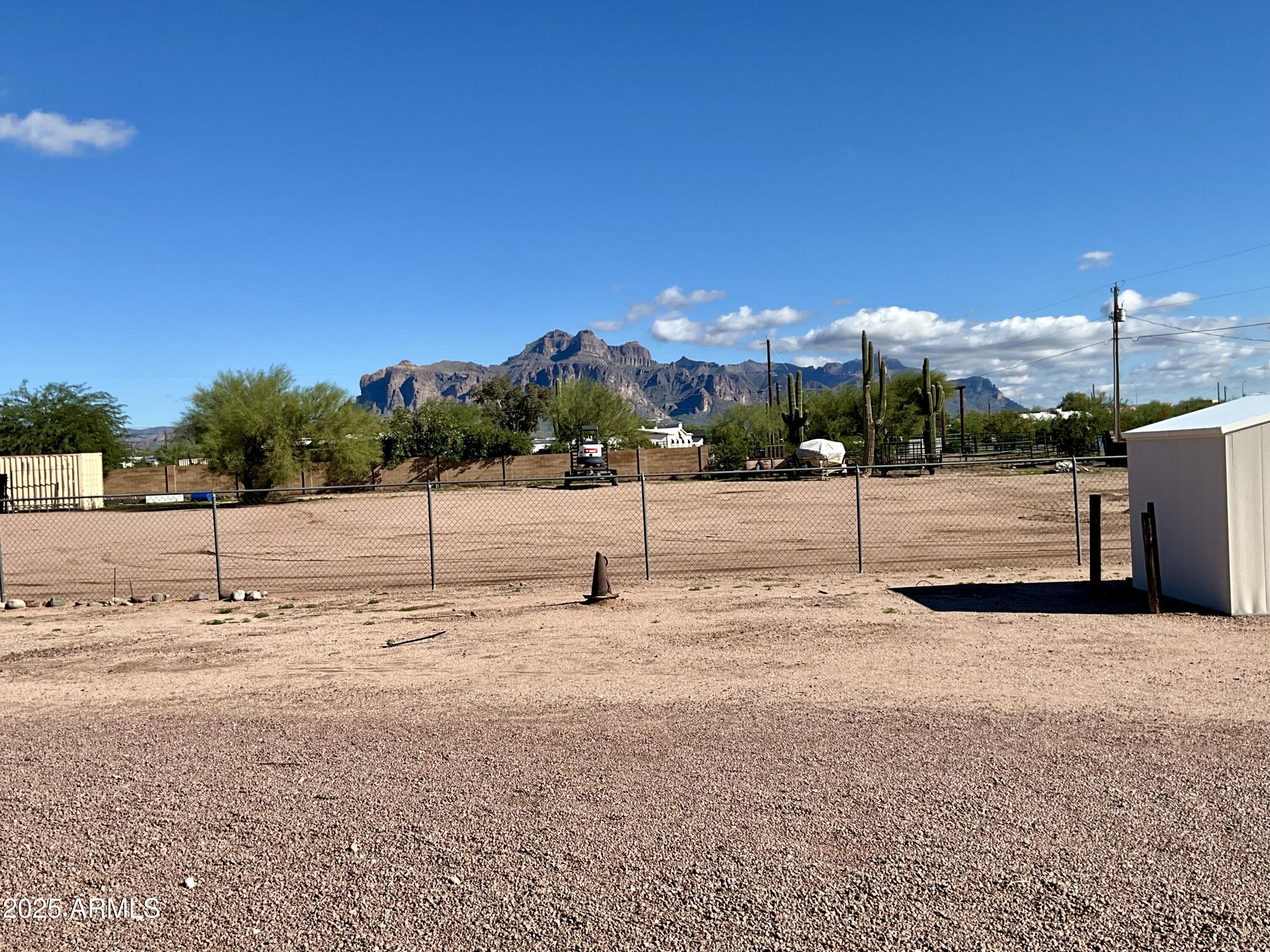 322 West Foothill Street Apache Junction, AZ 85120 - Photo 25 of 33 a view of a road with a yard
