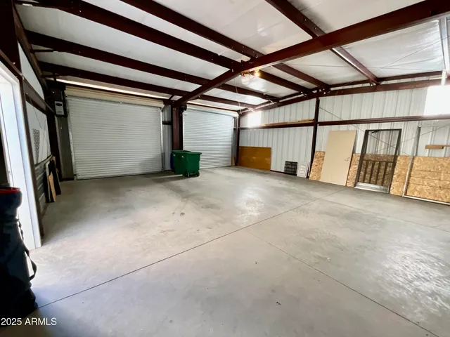 a view of a house with a wooden fence