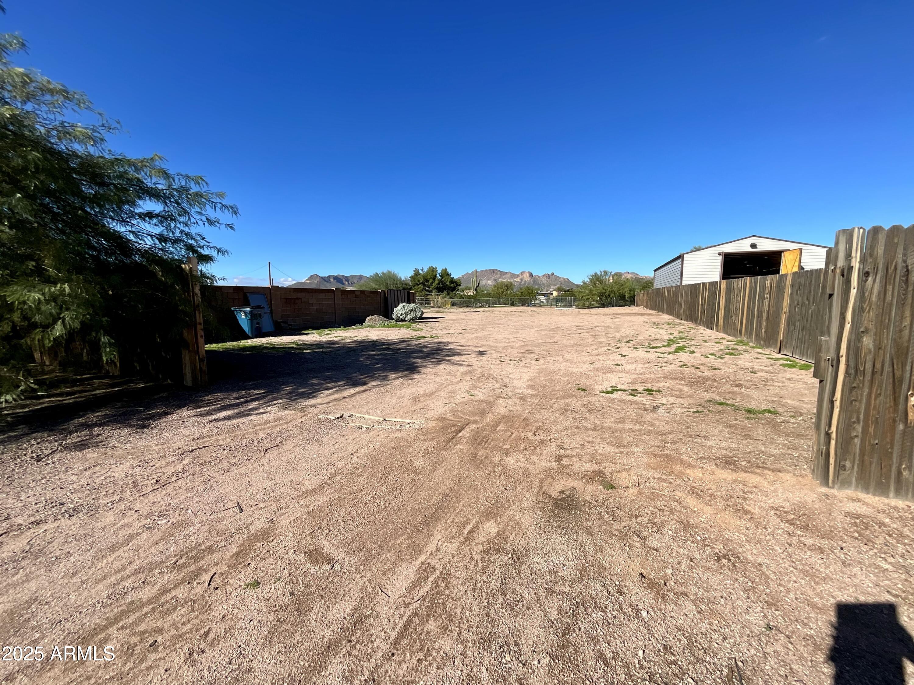 322 West Foothill Street Apache Junction, AZ 85120 - Photo 29 of 33 a backyard of a house with trees