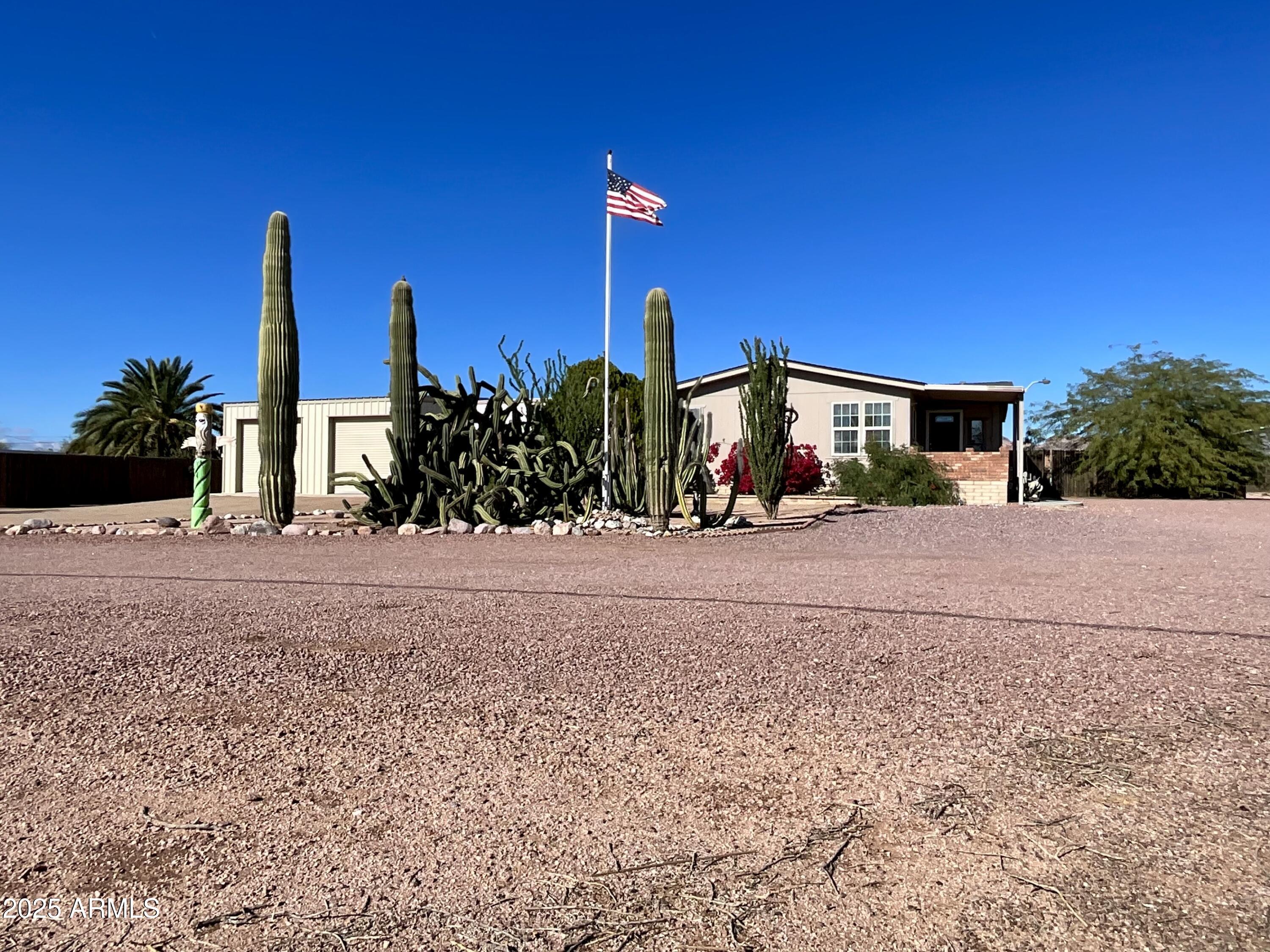 322 West Foothill Street Apache Junction, AZ 85120 - Photo 4 of 33 a front view of a house with a yard