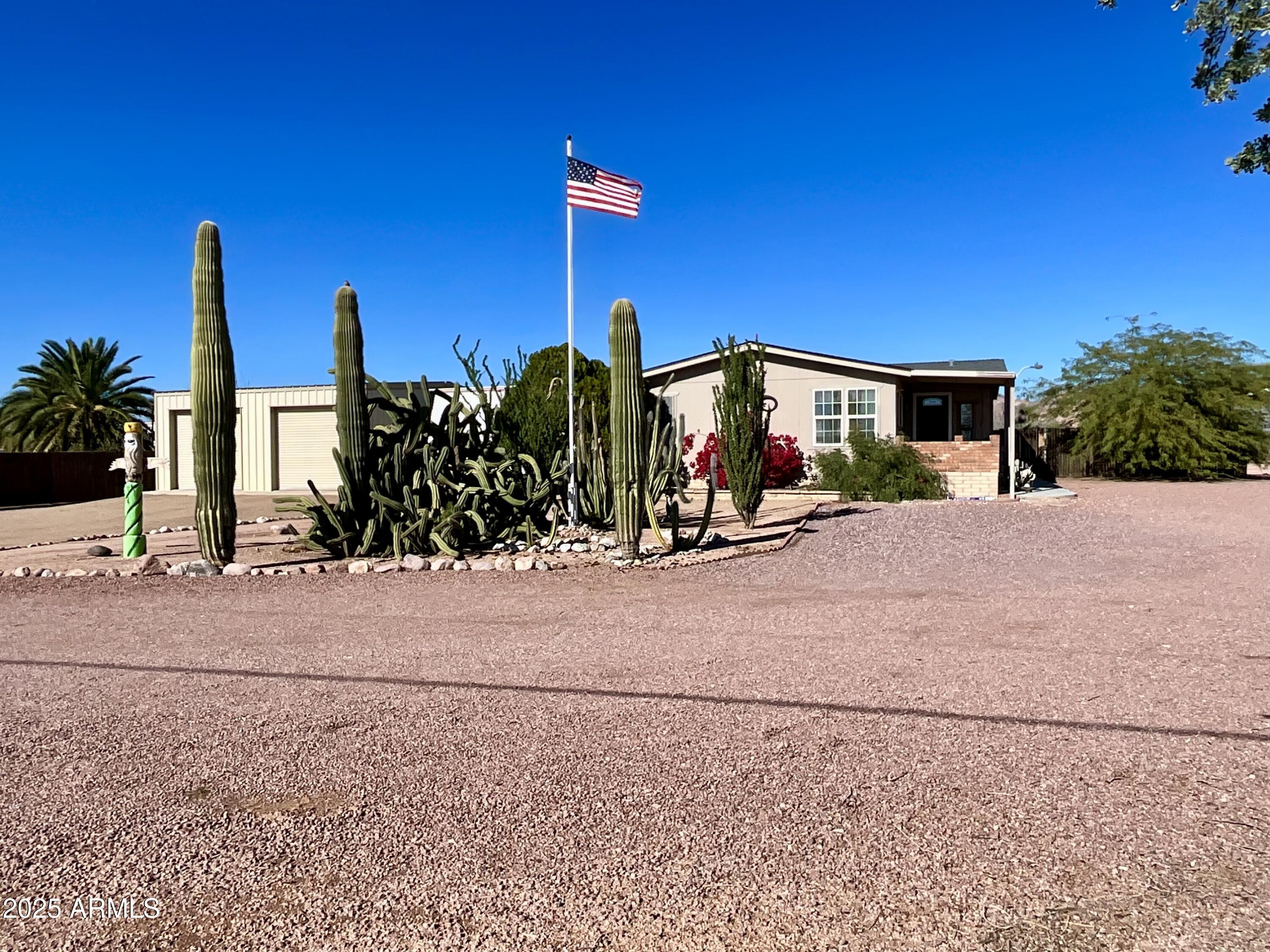 322 West Foothill Street Apache Junction, AZ 85120 - Photo 5 of 33 a view of a house with a yard