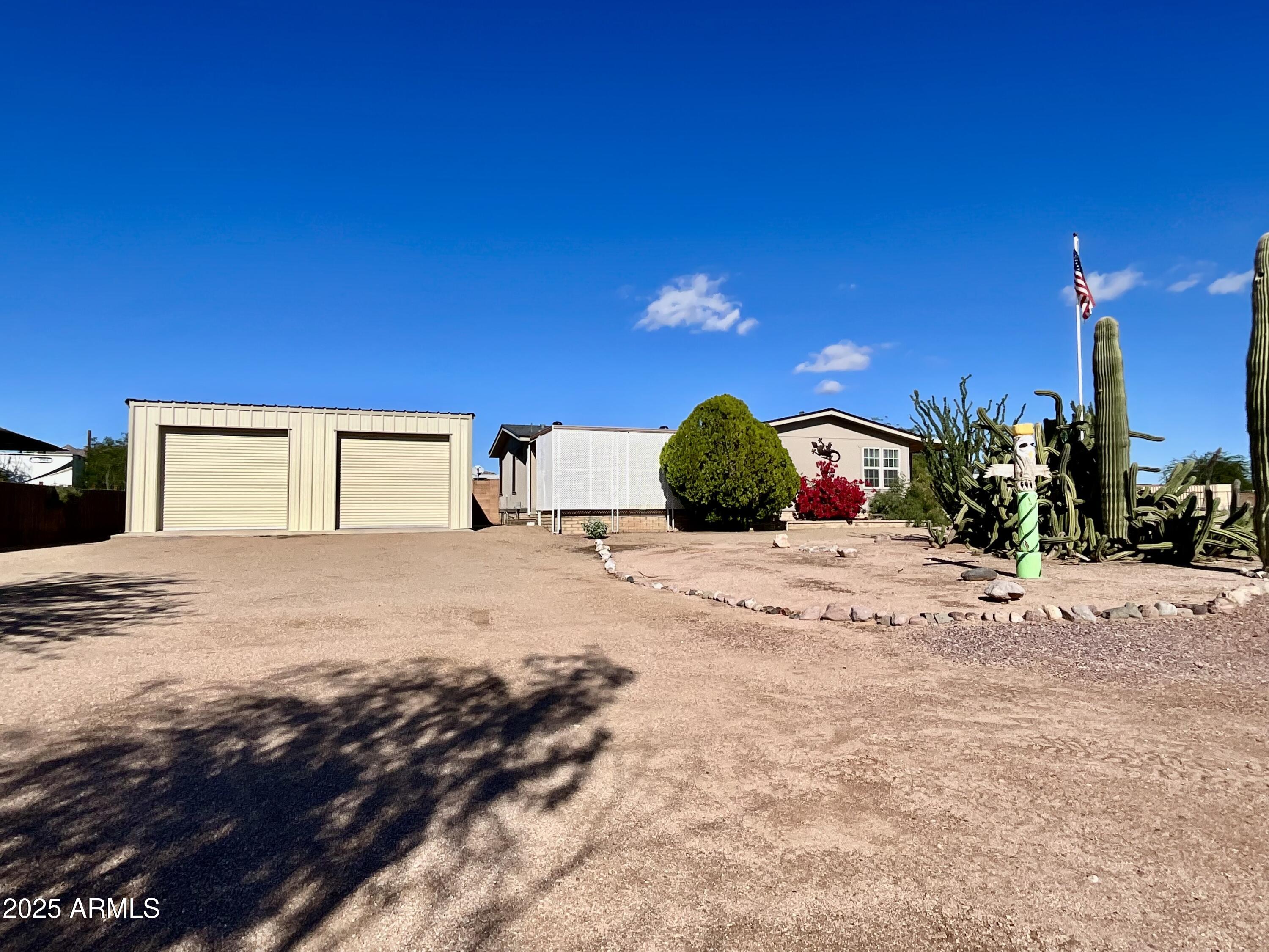 322 West Foothill Street Apache Junction, AZ 85120 - Photo 6 of 33 a view of a house with a yard
