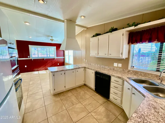 a spacious bathroom with a vanity and a shower