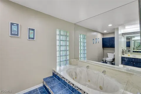 a bathroom with a bathtub and a sink