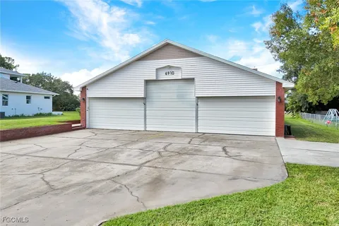 a front view of building with yard