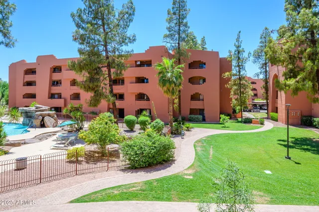 a front view of a building with garden