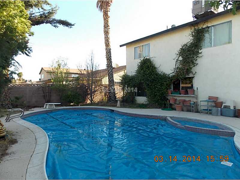 3236 Mountain Spring Road Las Vegas, NV 89146 - Photo 8 of 11 Exterior Back. Huge backyard pool/spa. Entire Pool pump system just replaced.