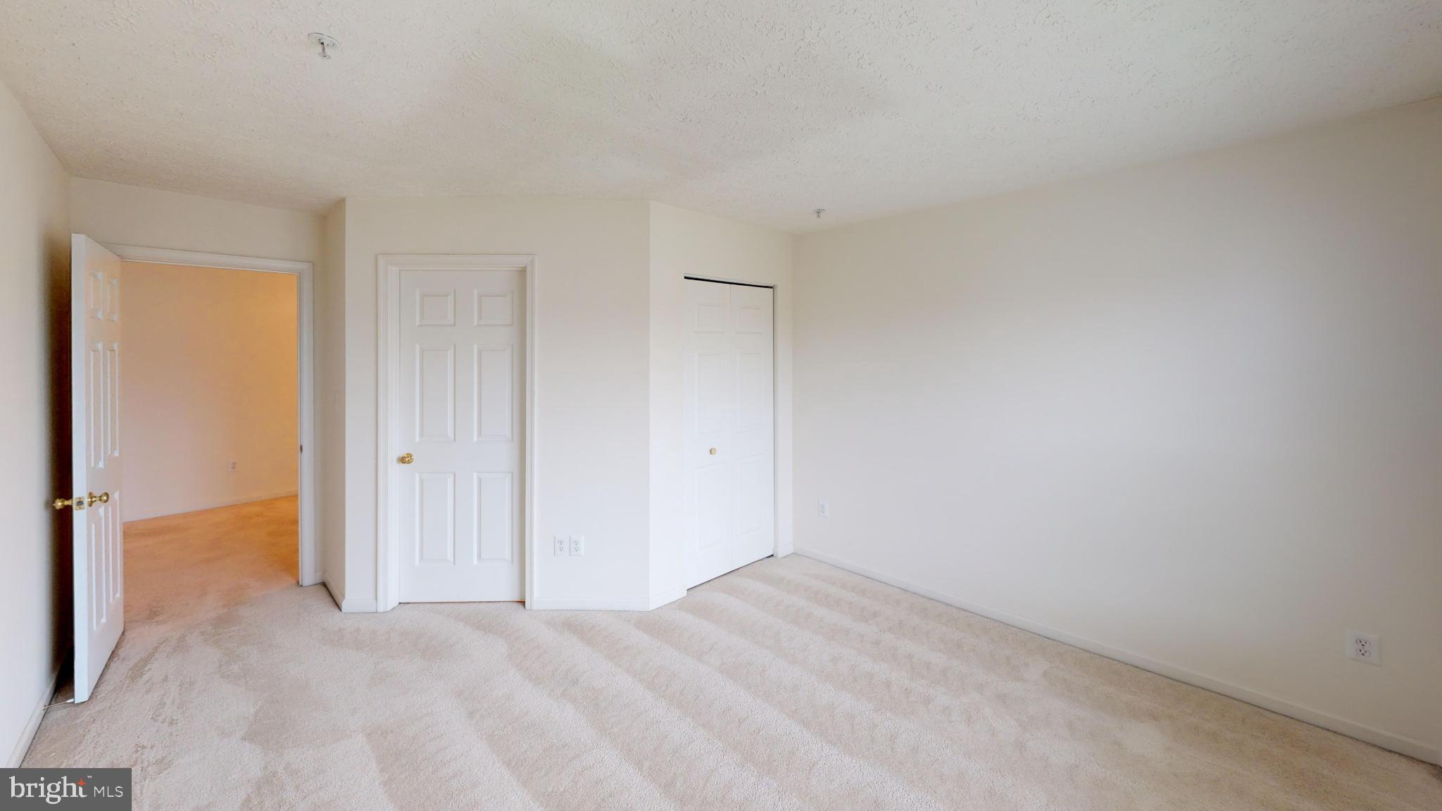 2443 Blue Spring Court, Unit 303 Odenton, MD 21113 - Photo 11 of 14 a view of an empty room