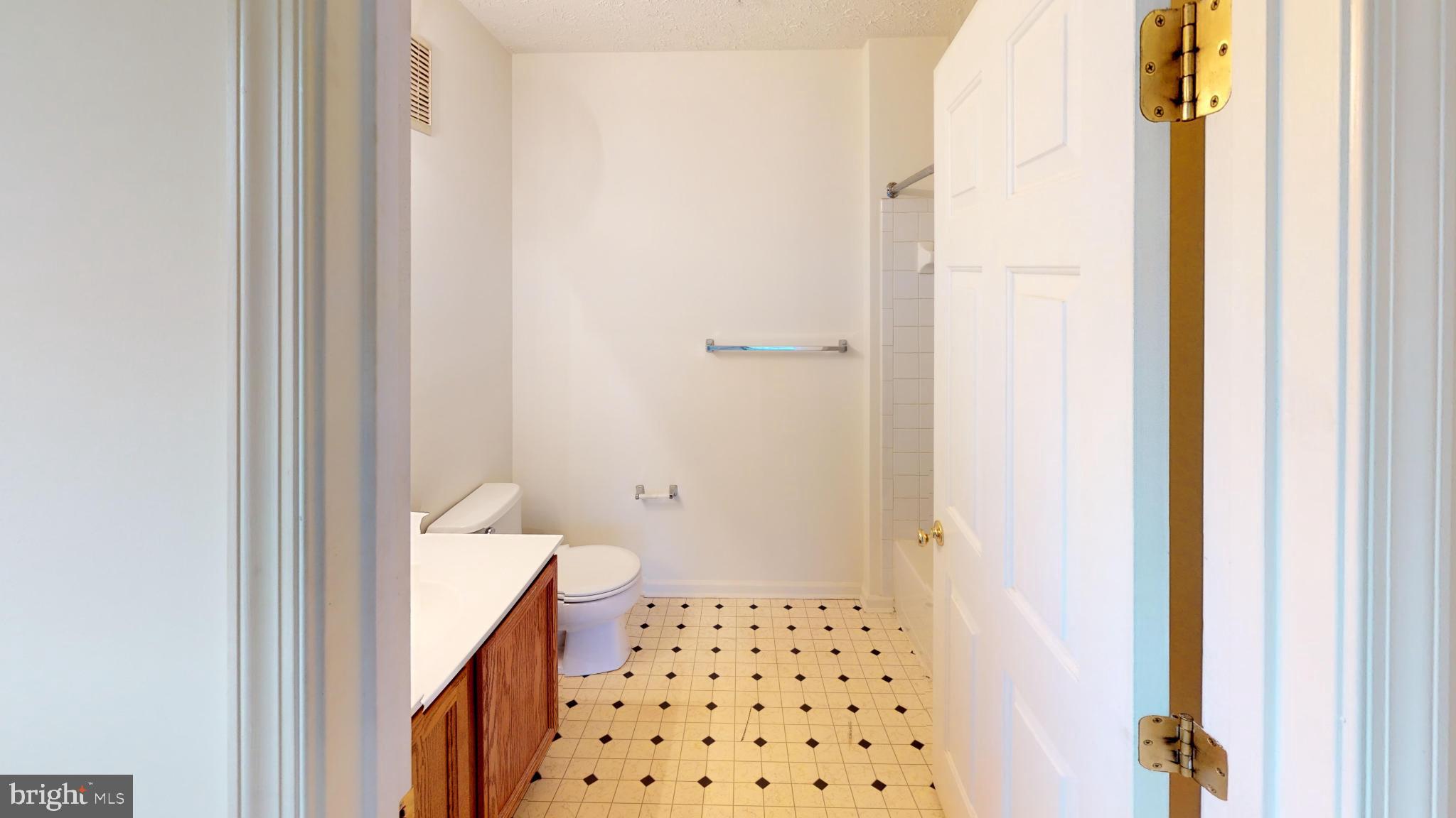 2443 Blue Spring Court, Unit 303 Odenton, MD 21113 - Photo 14 of 14 a bathroom with a sink and a toilet