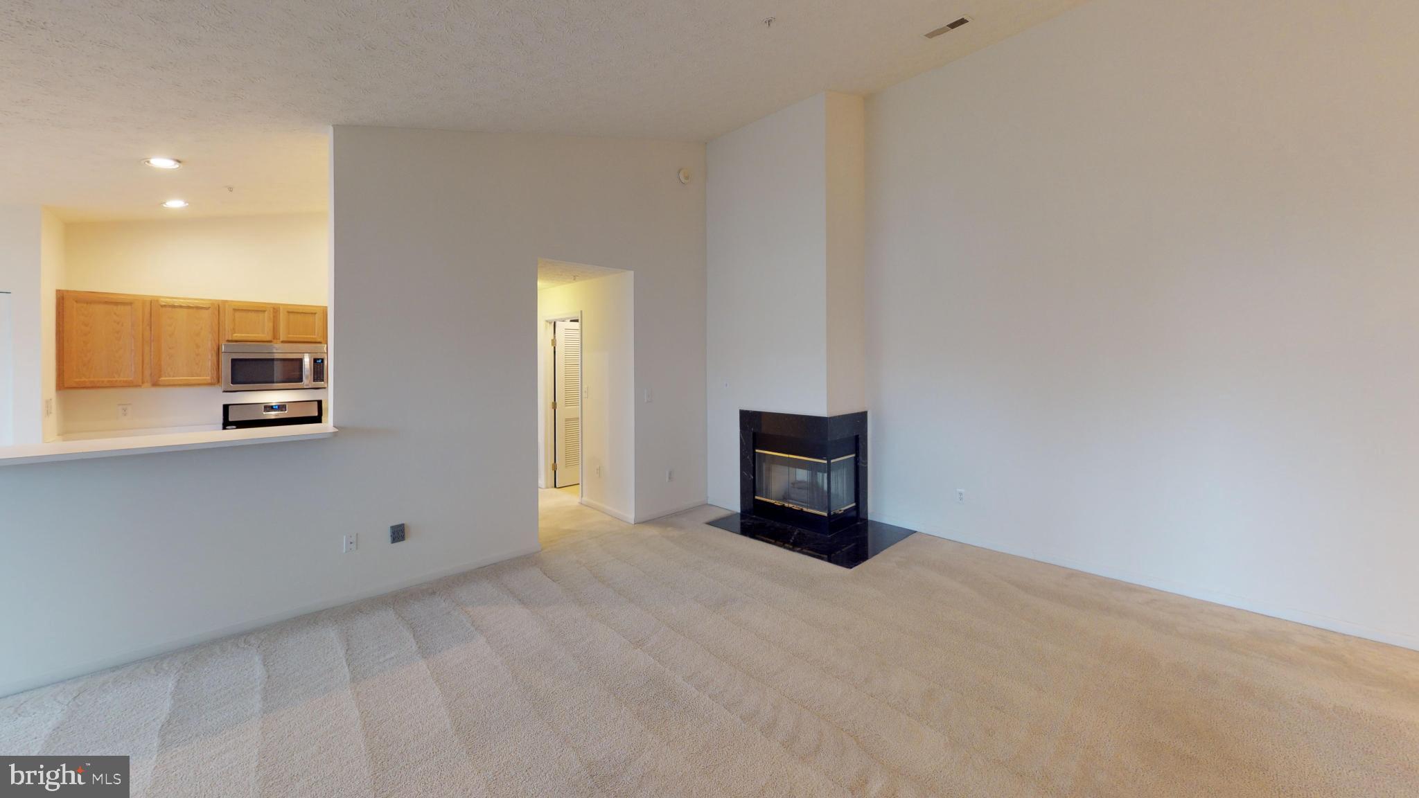 2443 Blue Spring Court, Unit 303 Odenton, MD 21113 - Photo 4 of 14 a view of an empty room with a bathroom