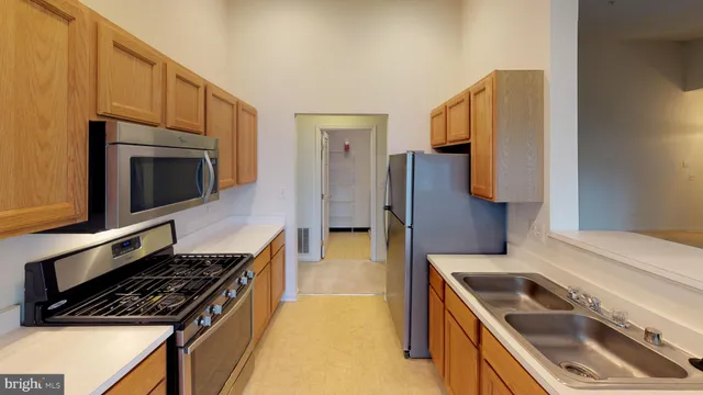 a kitchen with a stove and a microwave