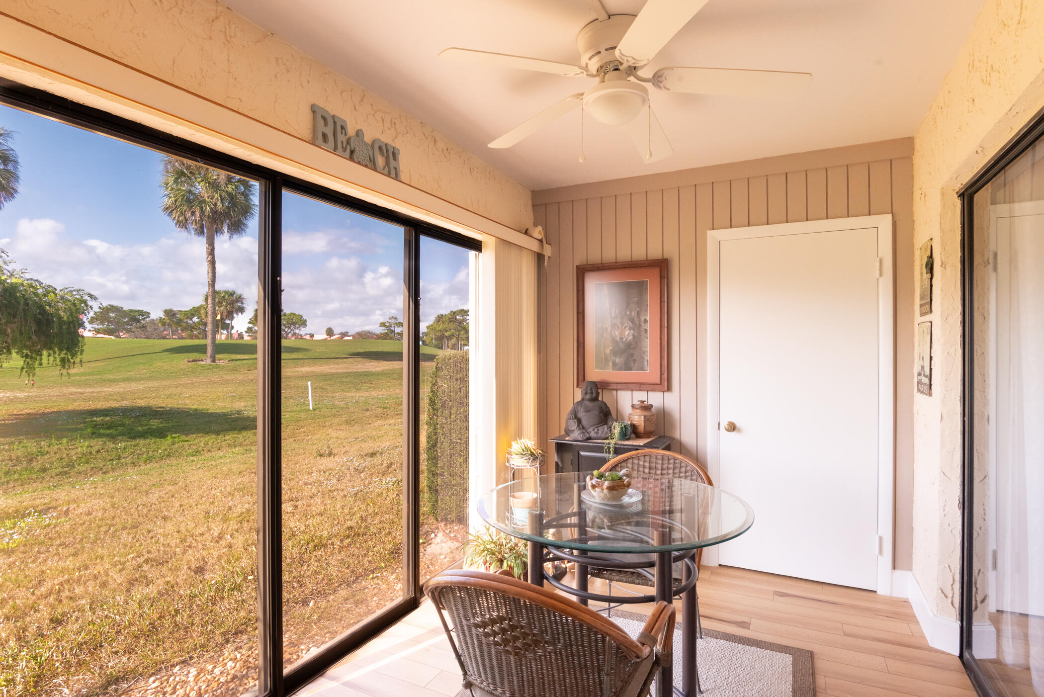 5403 Southeast Miles Grant Road, Unit 111 Stuart, FL 34997 - Photo 12 of 29 a view of a living room with furniture and floor to ceiling window